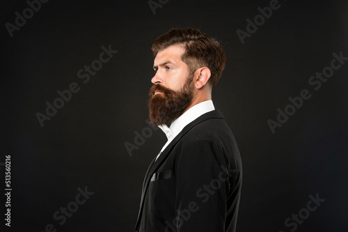 serious man in tuxedo bow tie. man profile in formalwear on black background. male formal fashion © be free
