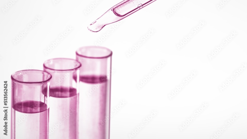 Three test tubes with pink liquid and lab droppers, Abstract body care cosmetics formulation concept Three test tubes with pink liquid and lab droppers, Abstract body care cosmetics formulation concept