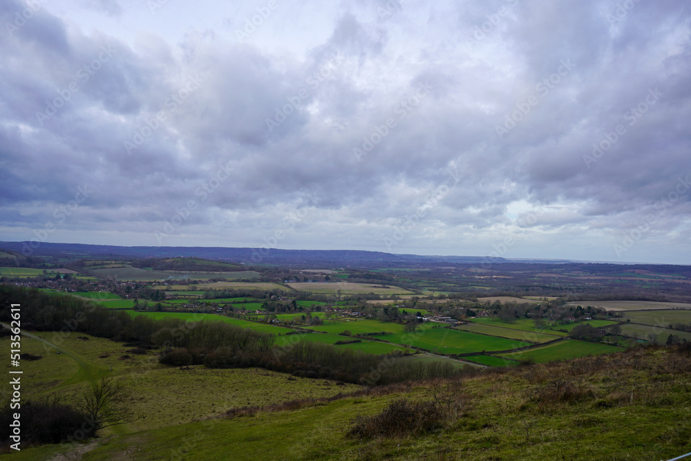 English countryside views over fields with overcast clouds