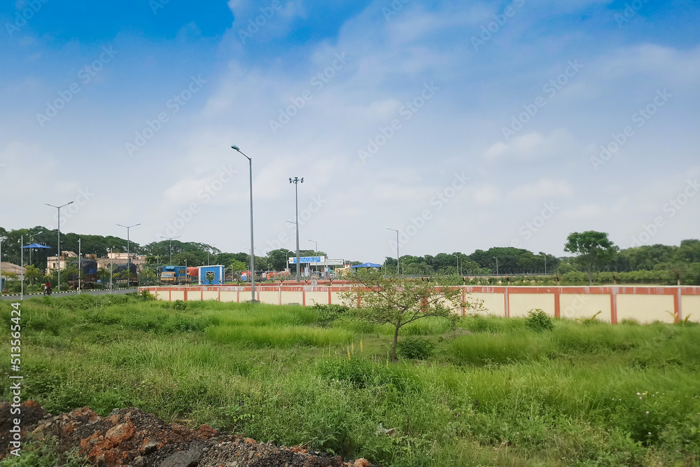 PETRAPOLE, WEST BENGAL , INDIA - JUNE 2ND 2018 : Indian side of international border between India and Bangladesh . Benapole is Bangladesh side. Bi lateral trade gateway between two countries. PETRAPOLE, WEST BENGAL , INDIA - JUNE 2ND 2018 : Indian side of international border between India and Bangladesh . Benapole is Bangladesh side. Bi lateral trade gateway between two countries.