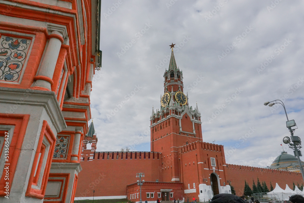 The Spasskaya Tower of the Moscow Kremlin on Red Square, with huge clock and five stars on top - The five-pointed red star has often served as a symbol of communism in Russia. The Spasskaya Tower of the Moscow Kremlin on Red Square, with huge clock and five stars on top - The five-pointed red star has often served as a symbol of communism in Russia.