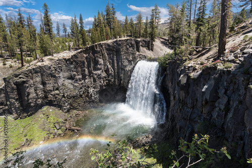 View of Rainbow Falls with rainbow near Devils Postpile and Mammoth Lakes in the California Sierra Nevada Mountains.