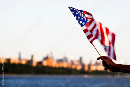 Fototapeta American flag during Independence Day on the Hudson River with a view at Manhatt