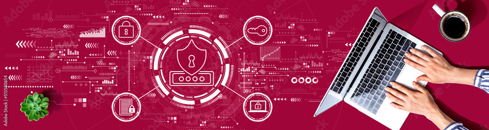 Cyber security theme with person using a laptop computer Cyber security theme with person using a laptop computer