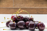 close up of a bunch of cherries isolated on a kitchen counter 