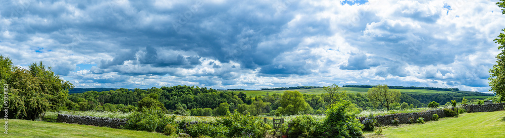 Summer storm clouds over Lathkill Dale in the Derbyshire Peak District Summer storm clouds over Lathkill Dale in the Derbyshire Peak District