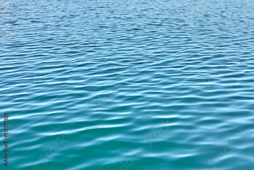 Water background with ripples and copyspace. Closeup of fresh, calm blue ocean water at low tide. Zoom in on rippled water surface with unique patterns of motion. Zen, tranquil small meditative waves