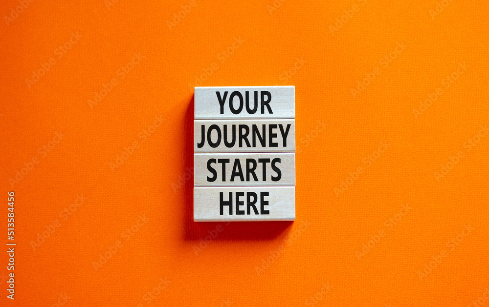Your journey starts here symbol. Concept words Your journey starts here on wooden blocks on a beautiful orange table orange background. Business, motivational and your journey starts here concept. Your journey starts here symbol. Concept words Your journey starts here on wooden blocks on a beautiful orange table orange background. Business, motivational and your journey starts here concept.