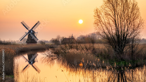 dutch windmill at sunset