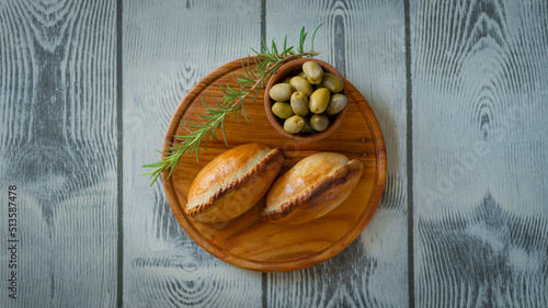 La salteña es un tipo de empanada de origen boliviano , ​ comido como una merienda jugosa y rellena con carne, pollo u otras carnes, huevo duro, especias, y otros ingredientes, cocida al horno