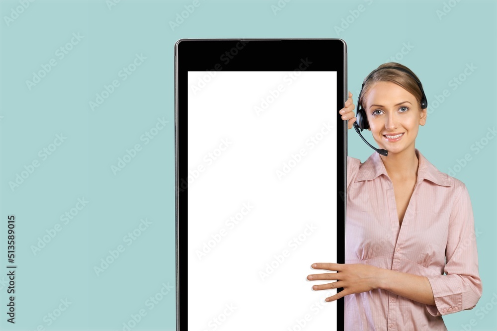 Young smiling happy woman with big mobile cell phone with blank screen workspace Young smiling happy woman with big mobile cell phone with blank screen workspace