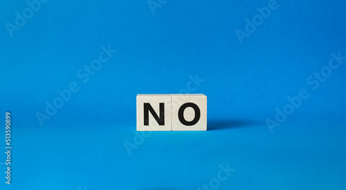 No symbol. Concept words No on wooden blocks. Beautiful blue background. Business and No concept. Copy space. © Natallia