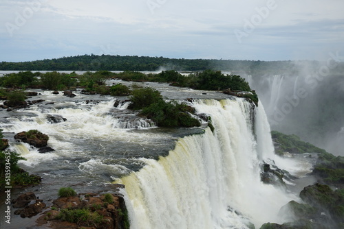 The photo shows a stunning view from the top of the Iguazu Falls     a complex of 275 waterfalls on the Iguazu River  located on the border of Brazil and Argentina.