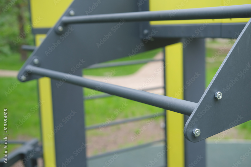horizontal bar for pull-ups on the playground outdoors in the forest close-up