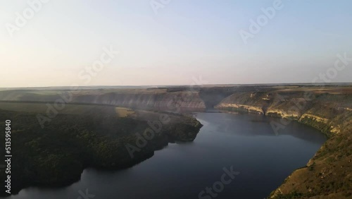 Podilski Tovtry, in Ukraine. 4k Ukrainian river Dniester, at sunset. There is fog over the river. photo