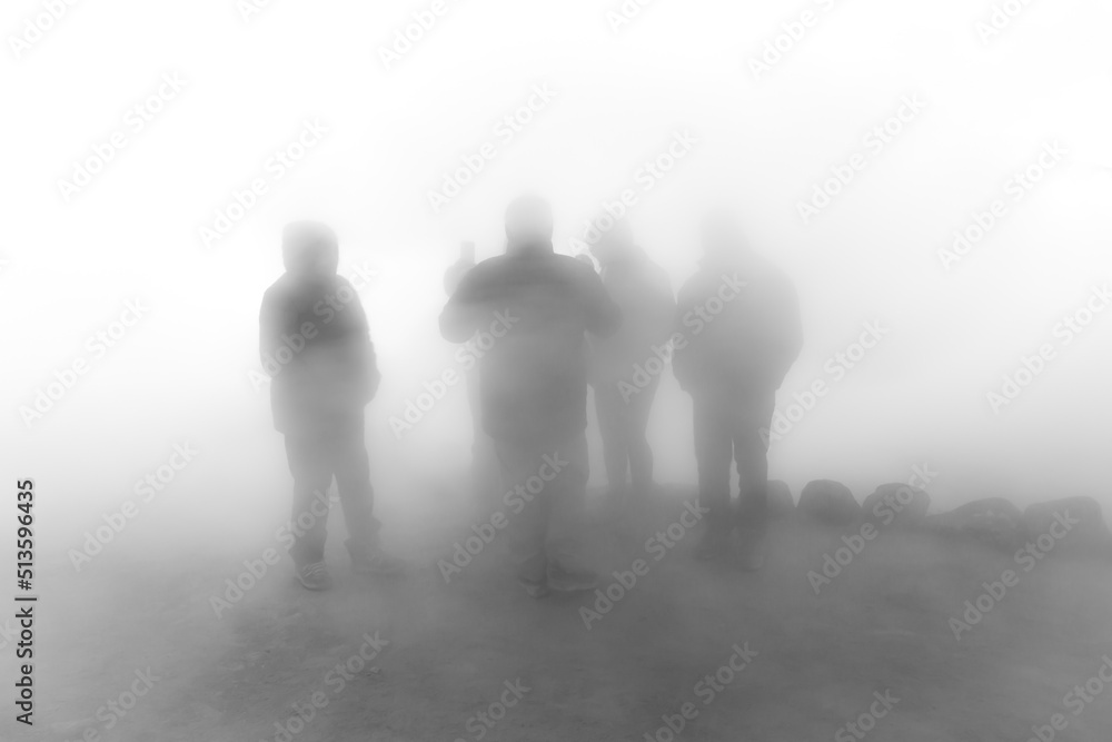 group of people together in heavy fog group of people together in heavy fog