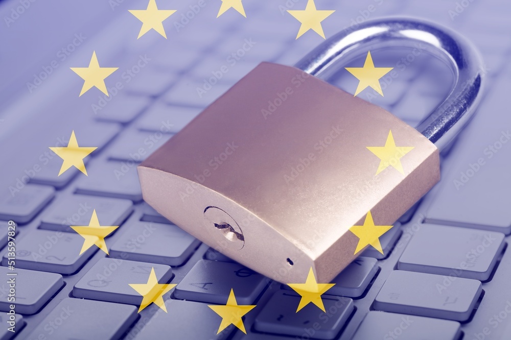Digital service act concept: lock on computer keyboard and europe flag Digital service act concept: lock on computer keyboard and europe flag