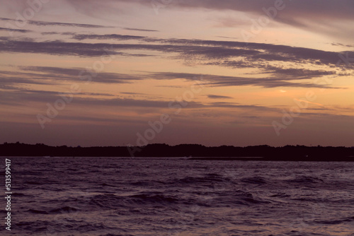 sunset over the sea sky  clouds  cloud  light  nature  weather  texture  sun  fog  cloudy  white  cloudscape  water  backdrop  color  storm  dark  coral background 