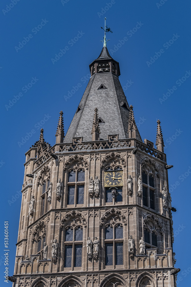 Architectural details of medieval Cologne Town Hall (Rathaus Koln) - XV century Gothic style tower. Cologne, North Rhine Westphalia, Germany.