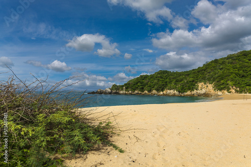 Huatulco bays - Cacaluta beach. Secret beach in Mexico only acessible by a trail in the jungle photo