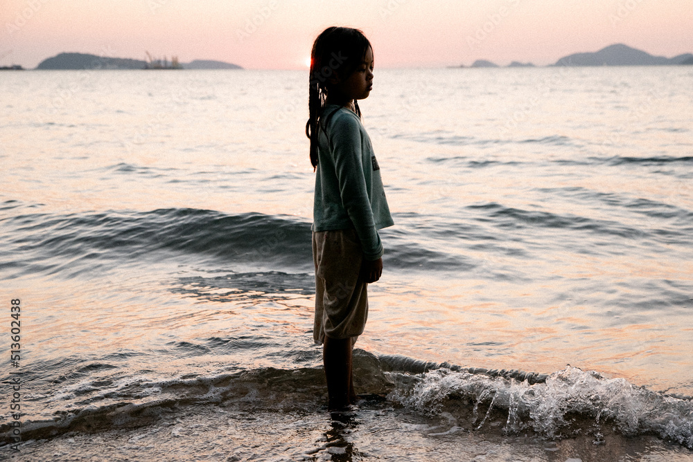 Asian Child Girl on the beach sunset Asian Child Girl on the beach sunset