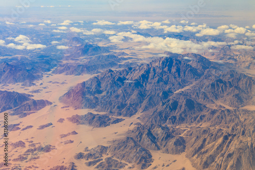 View of the Sinai mountains and desert in Egypt. View from a plane © olyasolodenko