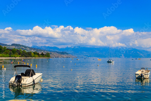 View of Lake Geneva with boats in Lausanne, Switzerland © olyasolodenko