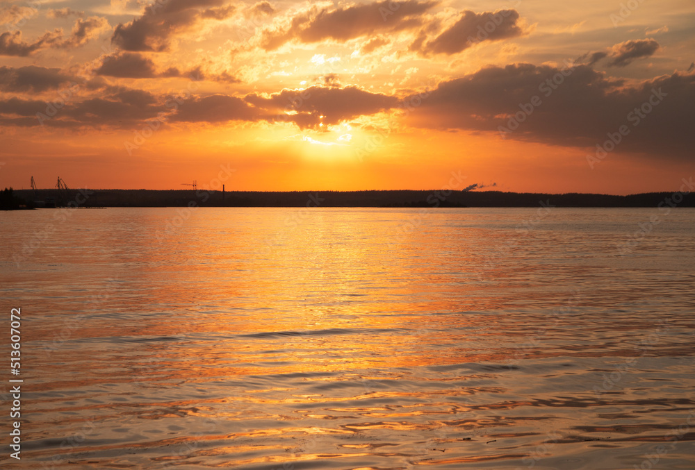 Beautiful sunset view with water and clouds Beautiful sunset view with water and clouds