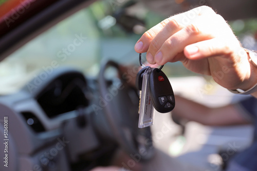 Rent Car Manager is giving keys of rent vehicle to the client