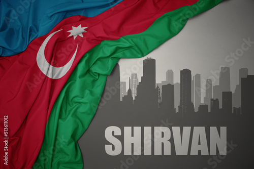 abstract silhouette of the city with text Shirvan near waving national flag of azerbaijan on a gray background.