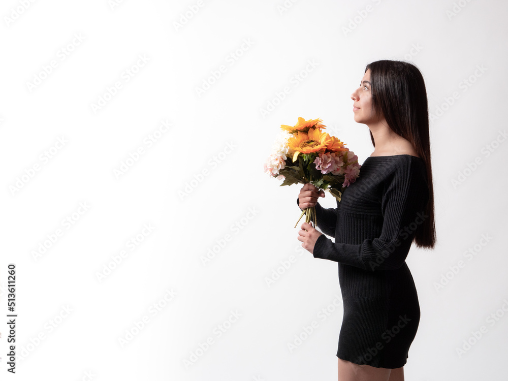 beautiful latina girl holding a bouquet of sunflowers, isolated on white background, mother's day gift concept. beautiful latina girl holding a bouquet of sunflowers, isolated on white background, mother's day gift concept.