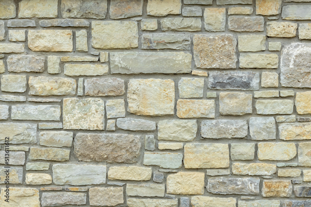 Solid beige and brown stone wall. Suitable for background Solid beige and brown stone wall. Suitable for background