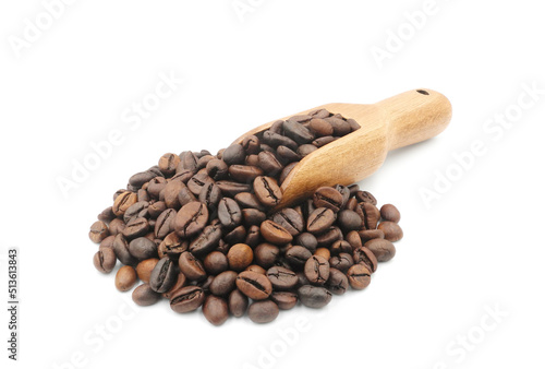 Coffee beans in wooden measuring scoop isolated on white background              