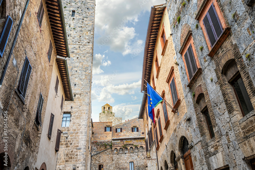 Obraz premium The historic walls and towers from inside the medieval Tuscan hill town of San Gimignano, Italy.