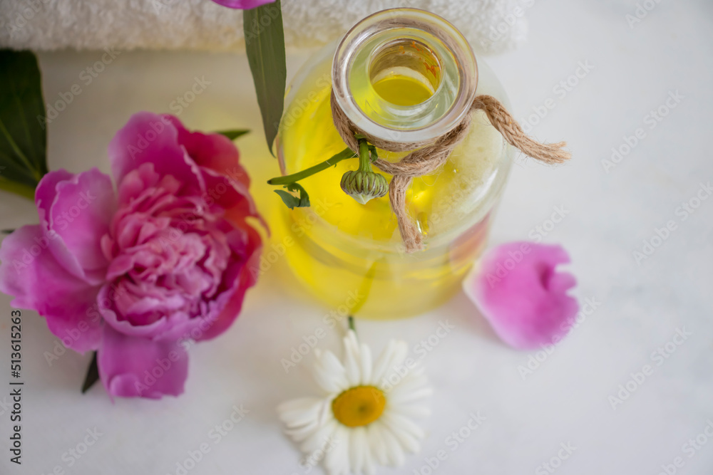 Oil cosmetic flower chamomile on a light background Oil cosmetic flower chamomile on a light background