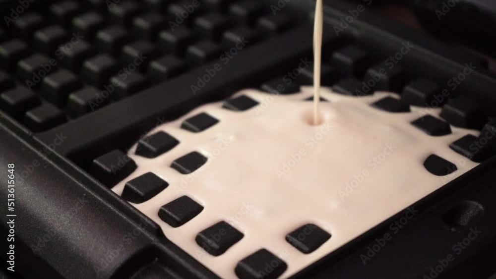 Stockvideo elgian waffles cooking process. Closeup chef pours waffle