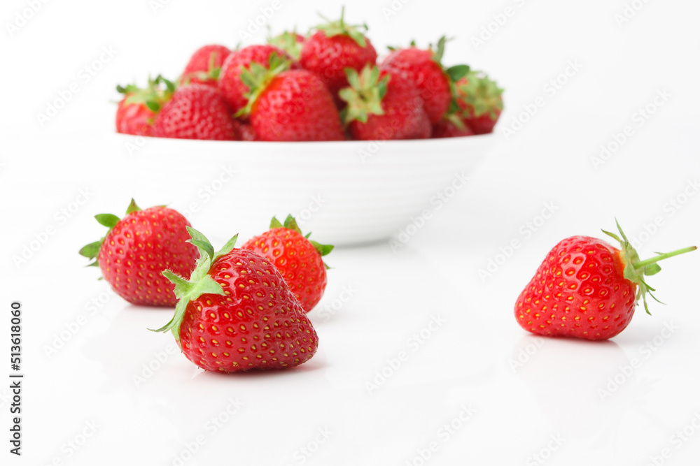 Red ripe strawberry in the white bowl, isolated Red ripe strawberry in the white bowl, isolated