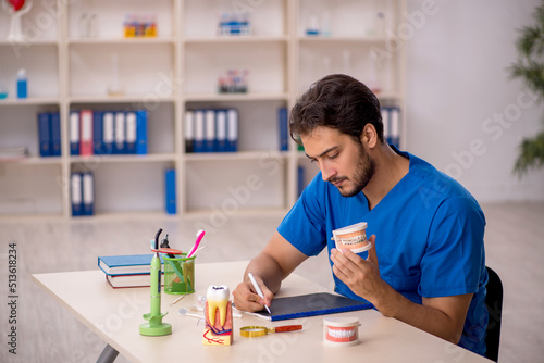 фотографія Young male dentist working in the clinic