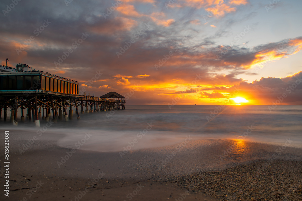 Long exposure of the sunrise at Cocoa Beach Pier. Long exposure of the sunrise at Cocoa Beach Pier.