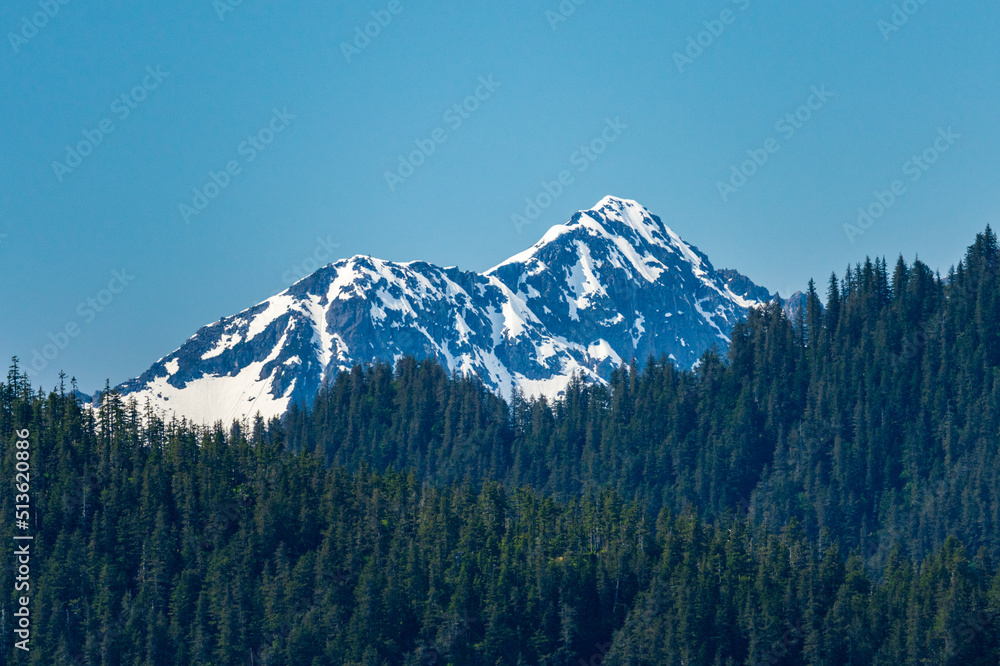 Snow covered peak of the mountain overlooking the port of Seward in Alaska