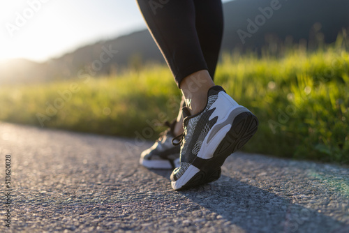 Low section view of fit young woman stretching her leg before a run