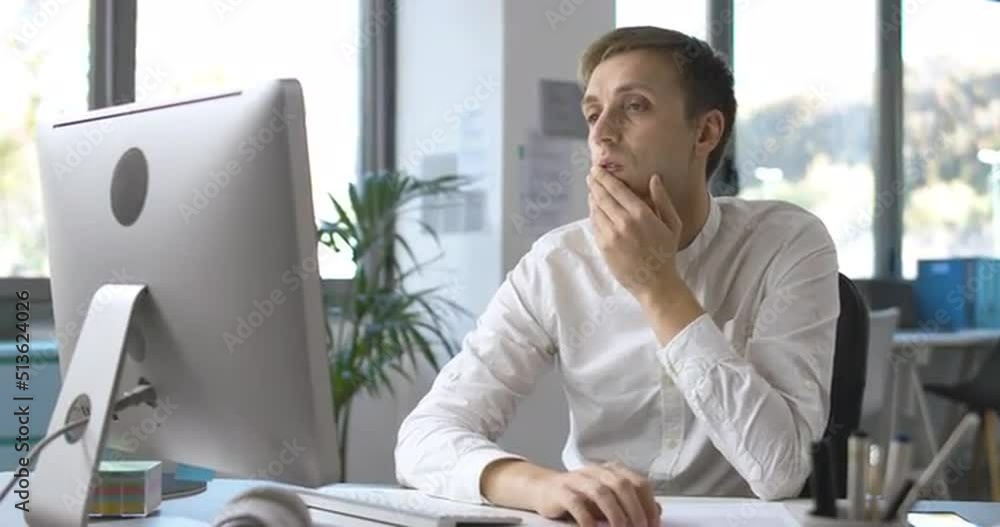Office worker connecting with his computer and working