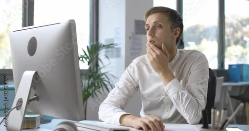 Office worker connecting with his computer and working