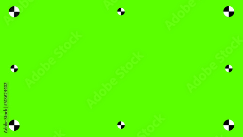 Green colored chroma key background - Chroma key VFX screen set with tracking marks on an abstract background - concept for video footage
