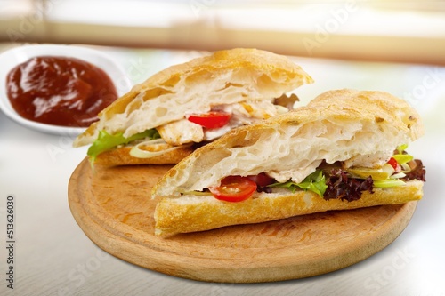 Tasty sandwich with vegetables, ham and cheese, traditional restaurant menu dish, food cooking recipe book cover.
