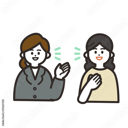 話し合うスーツの女性と女性