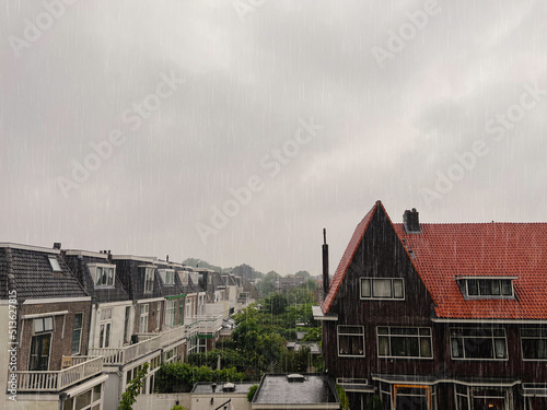 Fototapeta Naklejka Na Ścianę i Meble -  Picturesque view of city street with beautiful buildings on rainy day