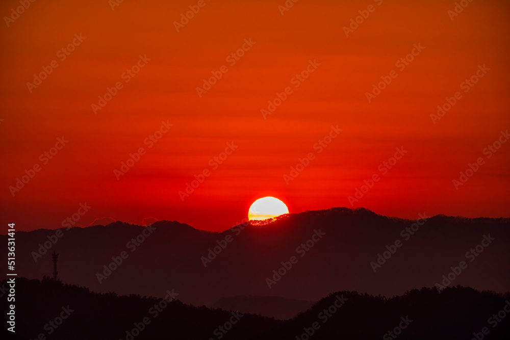 Scenic view of mountains against sky during sunrise Scenic view of mountains against sky during sunrise