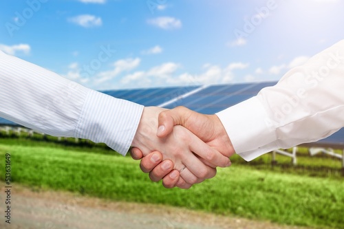 Boss making agreement with builder after successful work, photovoltaic panels producing solar power