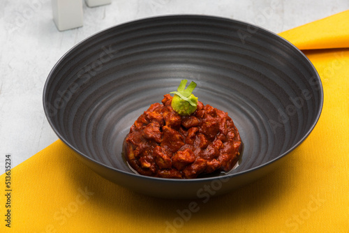Dish of pork meat cut into small pieces marinated in a mixture of different dried chilies and spices, which is commonly called in Mexico as Asado de bodas.